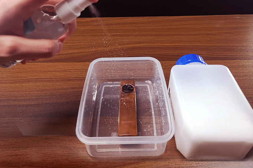 Spray copper flashlight with salt water